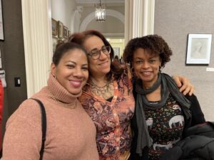 A group of women together smiling.